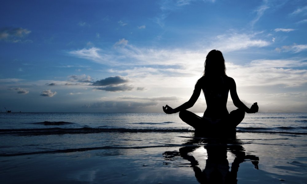 Person practicing gentle stretching in a calm room